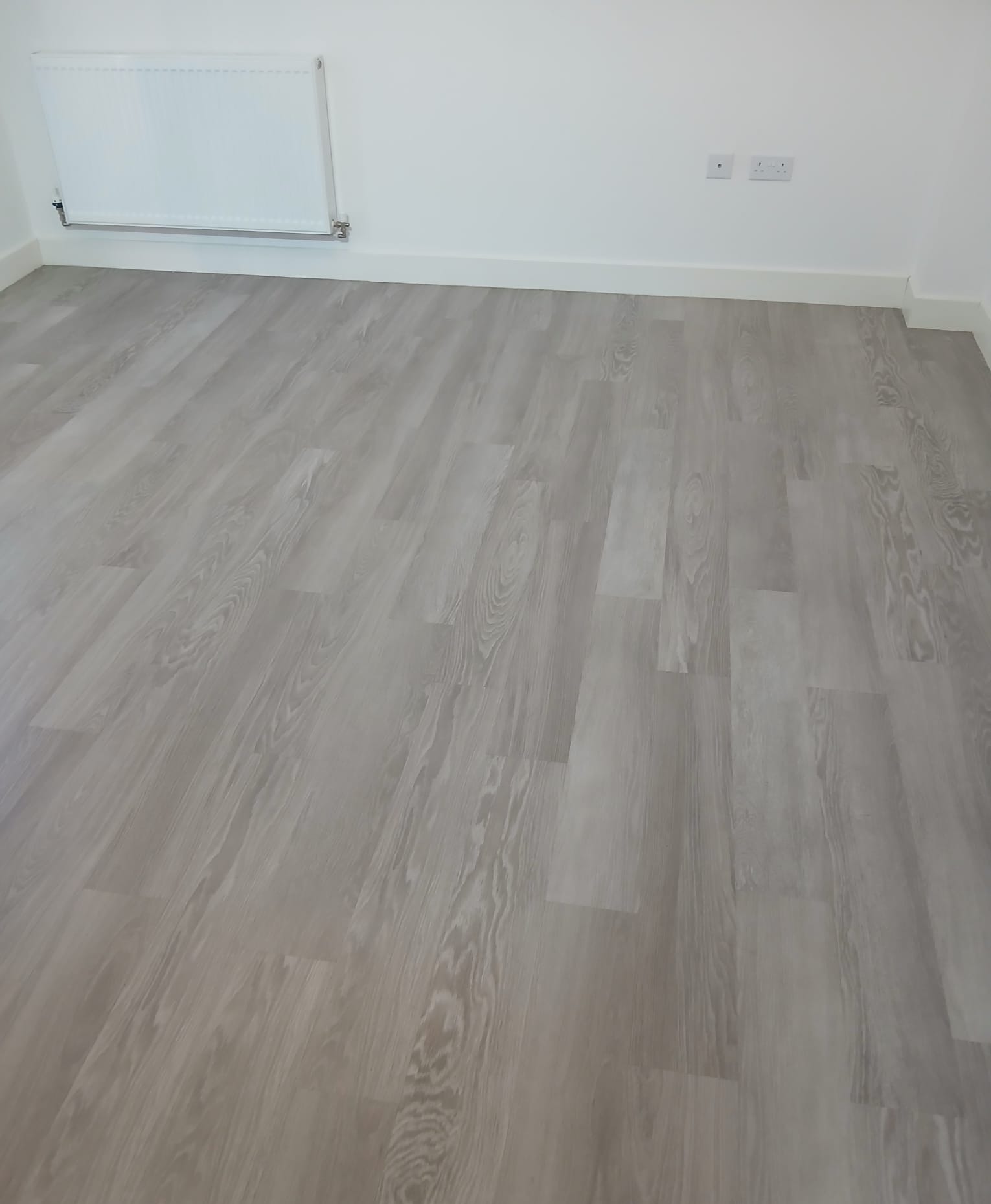 Grey Wood-Grain Laminate Floor Buffing
